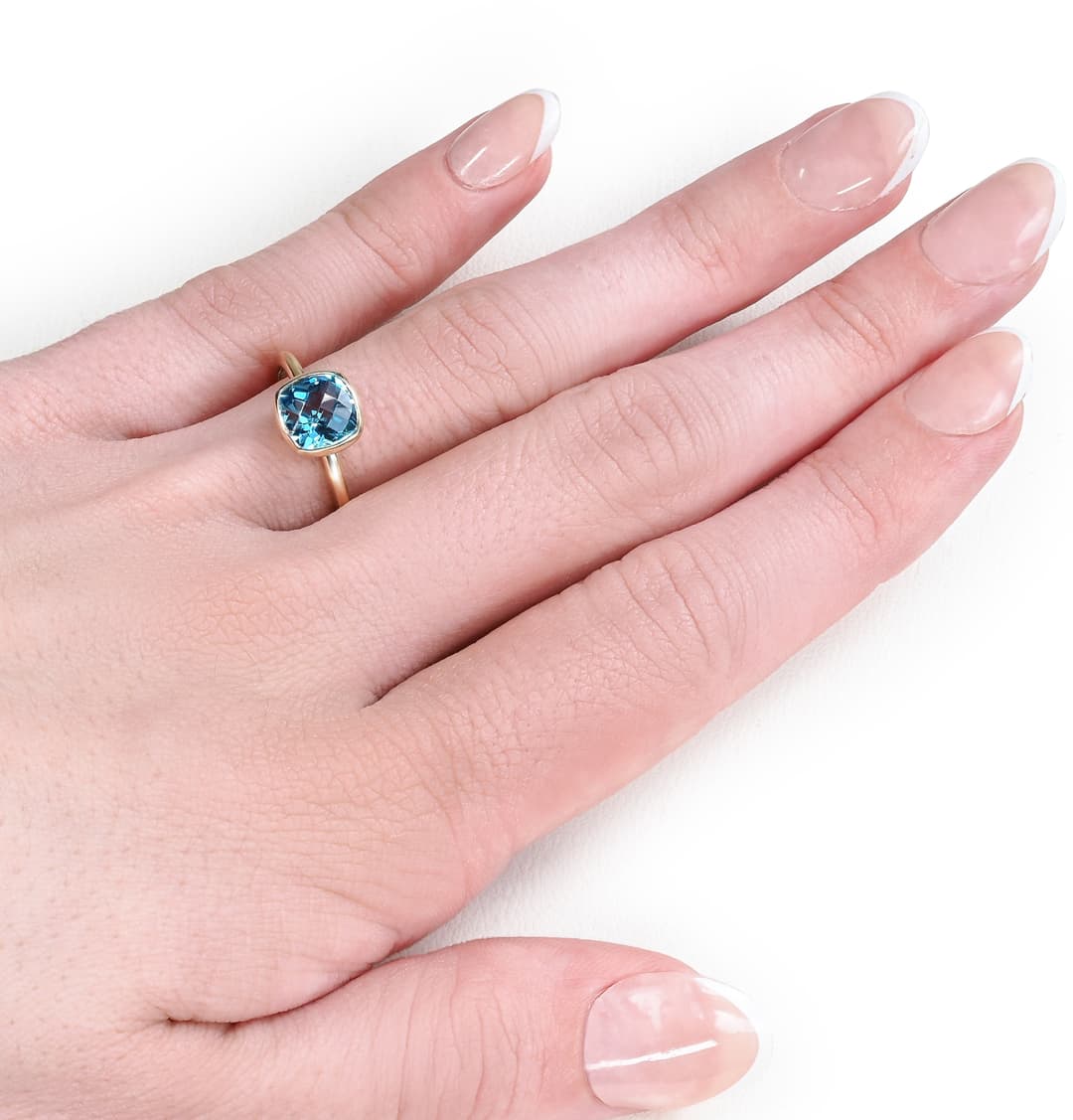 14KY GOLD BEZEL SET BLUE TOPAZ 7X7MM CUSHION SHAPE RING